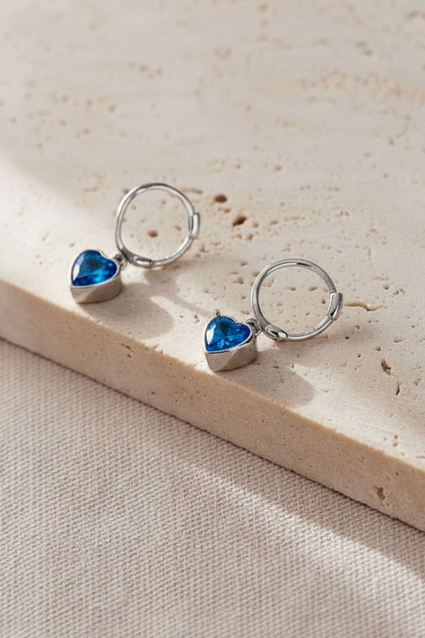 sterling-silver-cz-heart-hoops-in-silver-blue