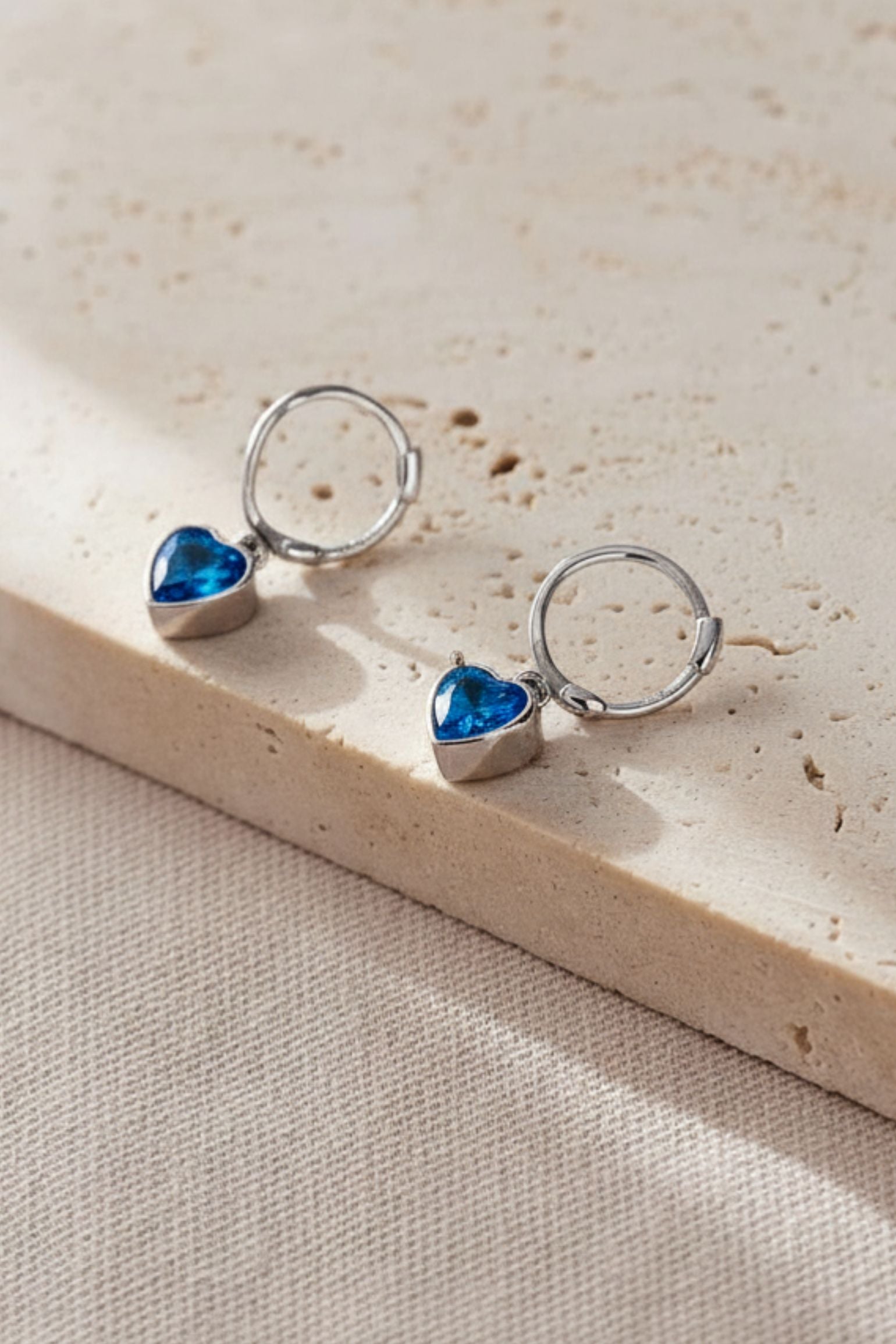 sterling-silver-cz-heart-hoops-in-silver-blue