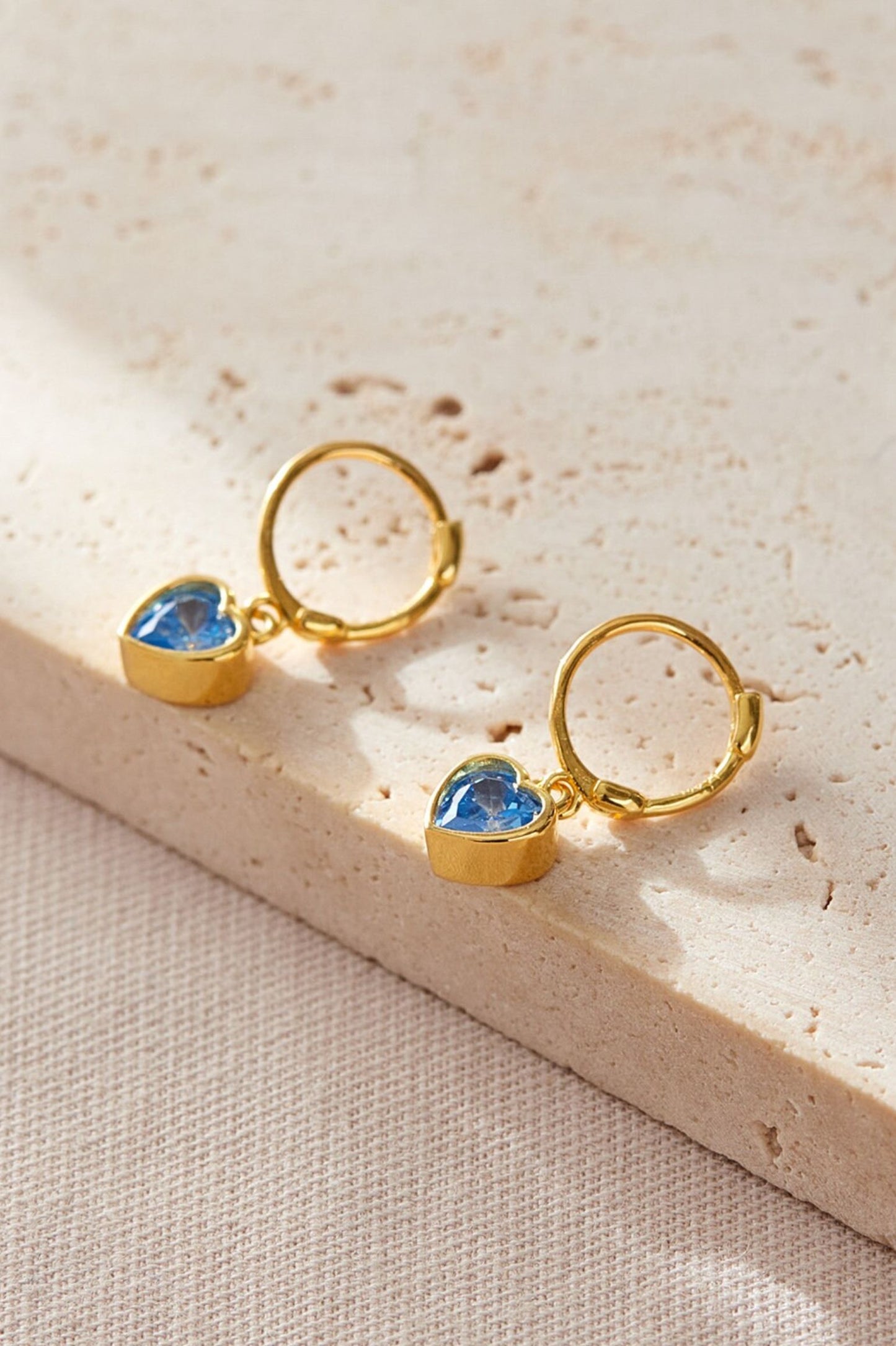 sterling-silver-cz-heart-hoops-in-gold-light-blue