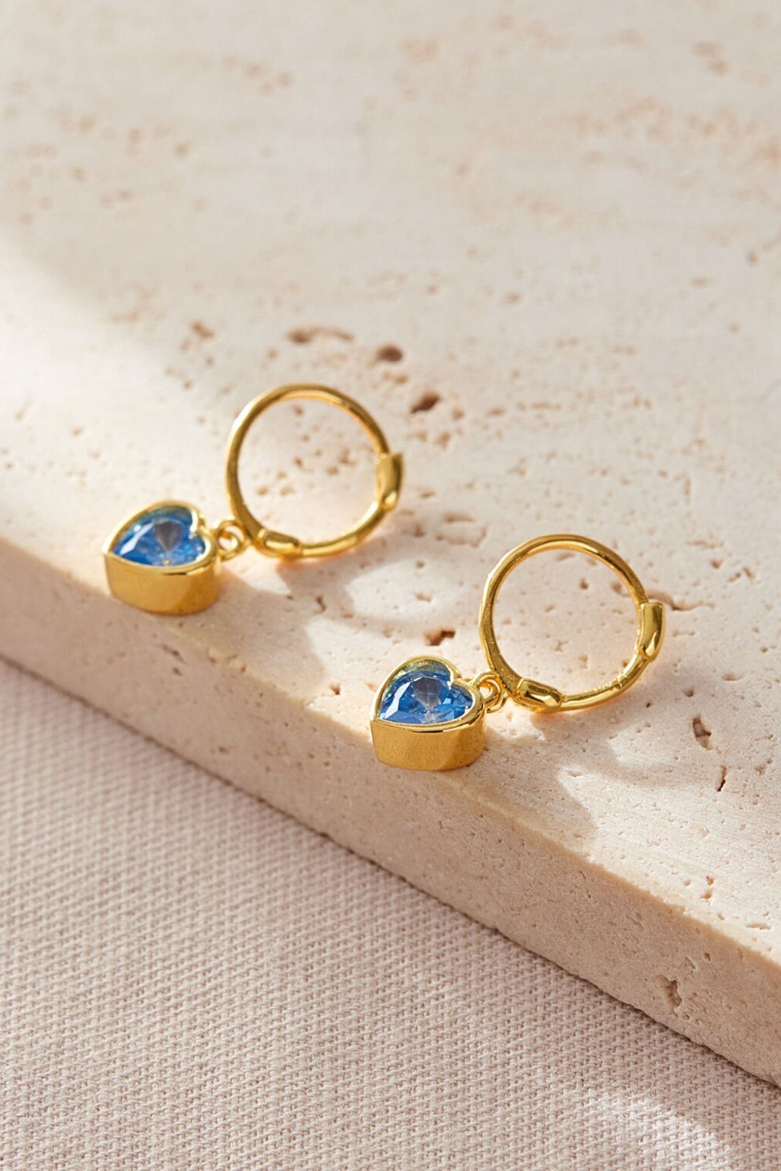 sterling-silver-cz-heart-hoops-in-gold-light-blue