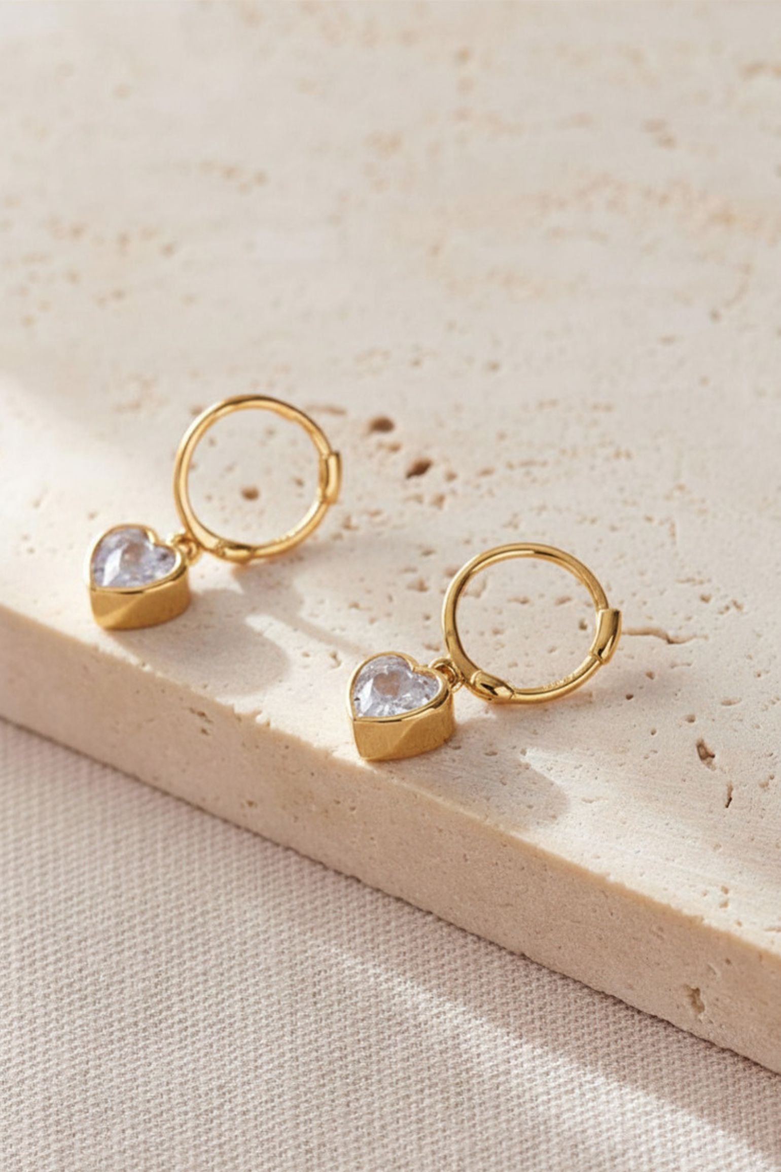 
sterling-silver-cz-heart-hoops-in-gold-white
