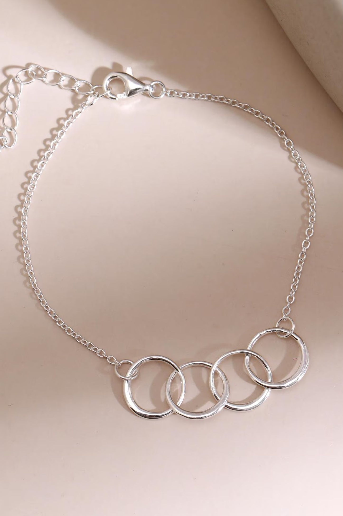 sterling-silver-four-rings-bracelet-lying-flat