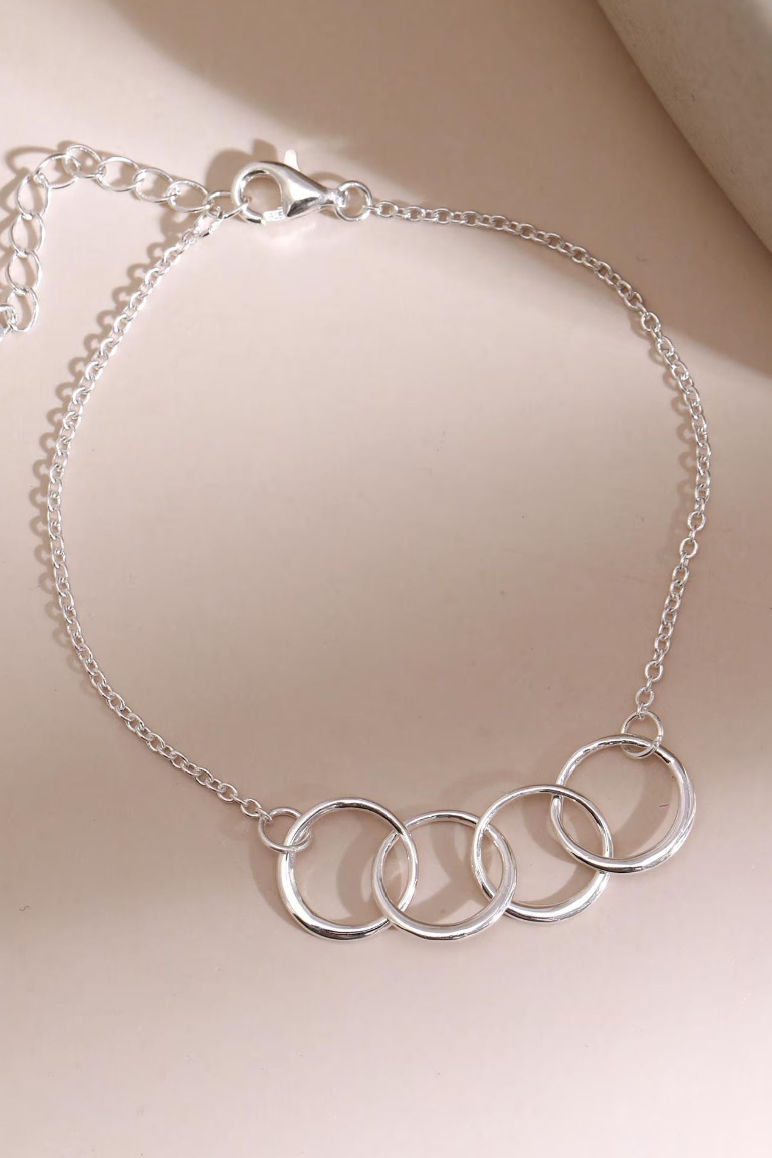 sterling-silver-four-rings-bracelet-lying-flat