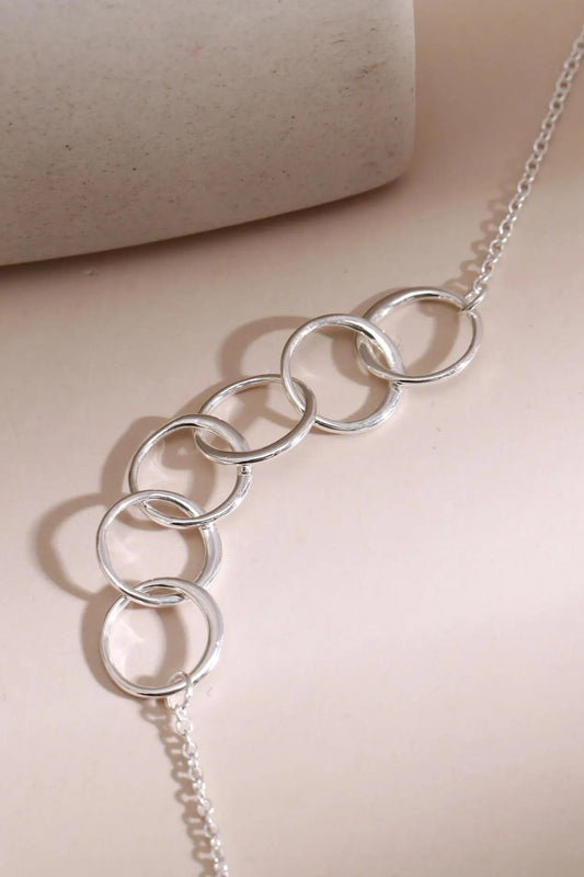 sterling-silver-six-rings-bracelet-60th-closeup