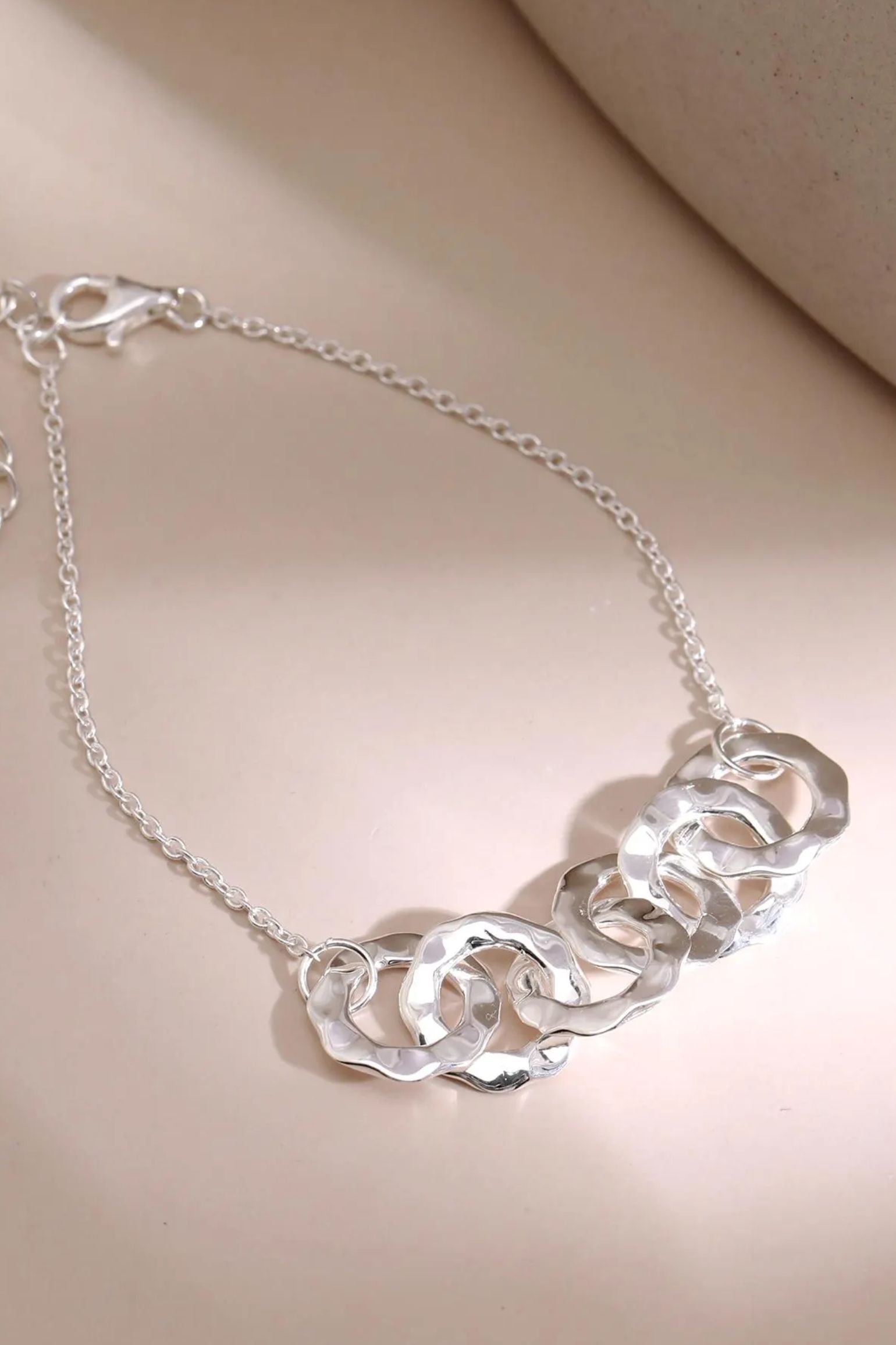 sterling-silver-six-hammered-rings-bracelet-lying-flat