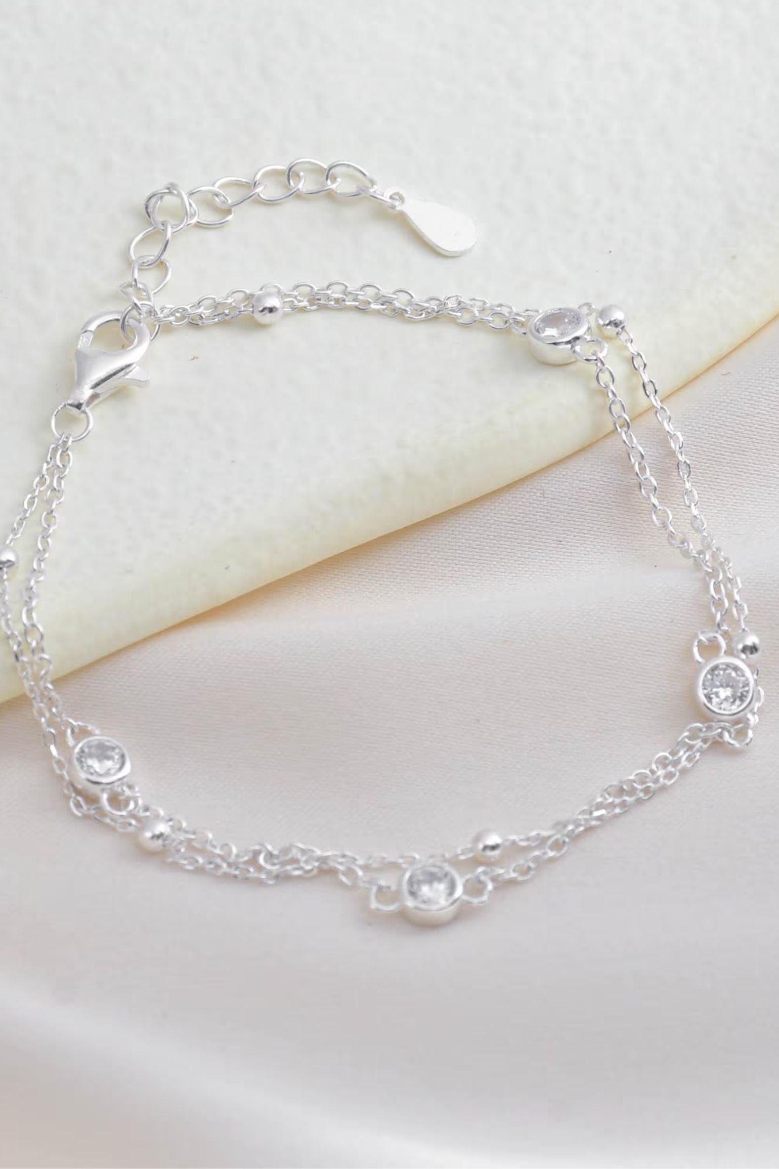 sterling-silver-cz-double-chain-bracelet-lying-flat