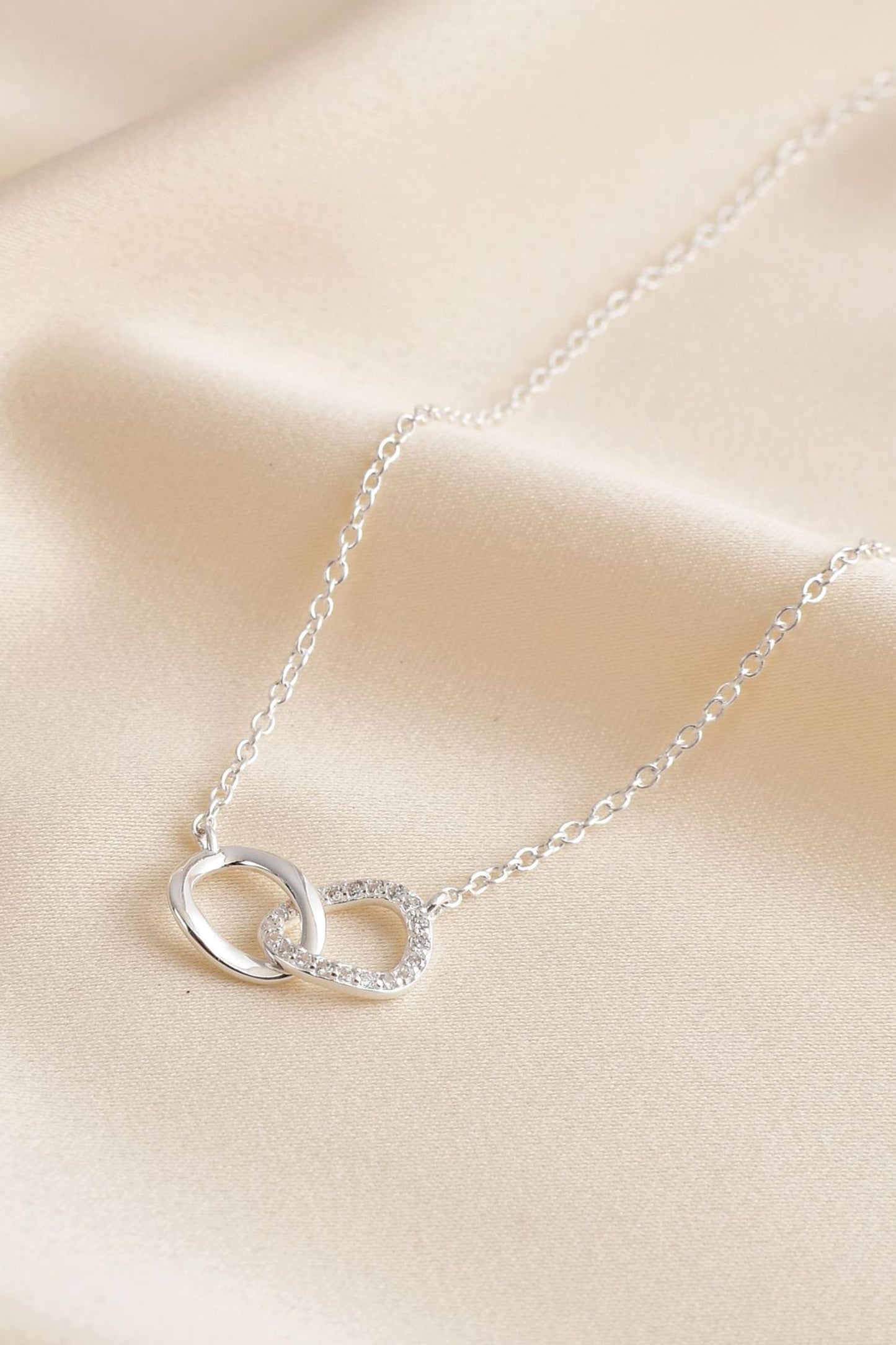 sterling-silver-cz-infinity-hoop-necklace-closeup