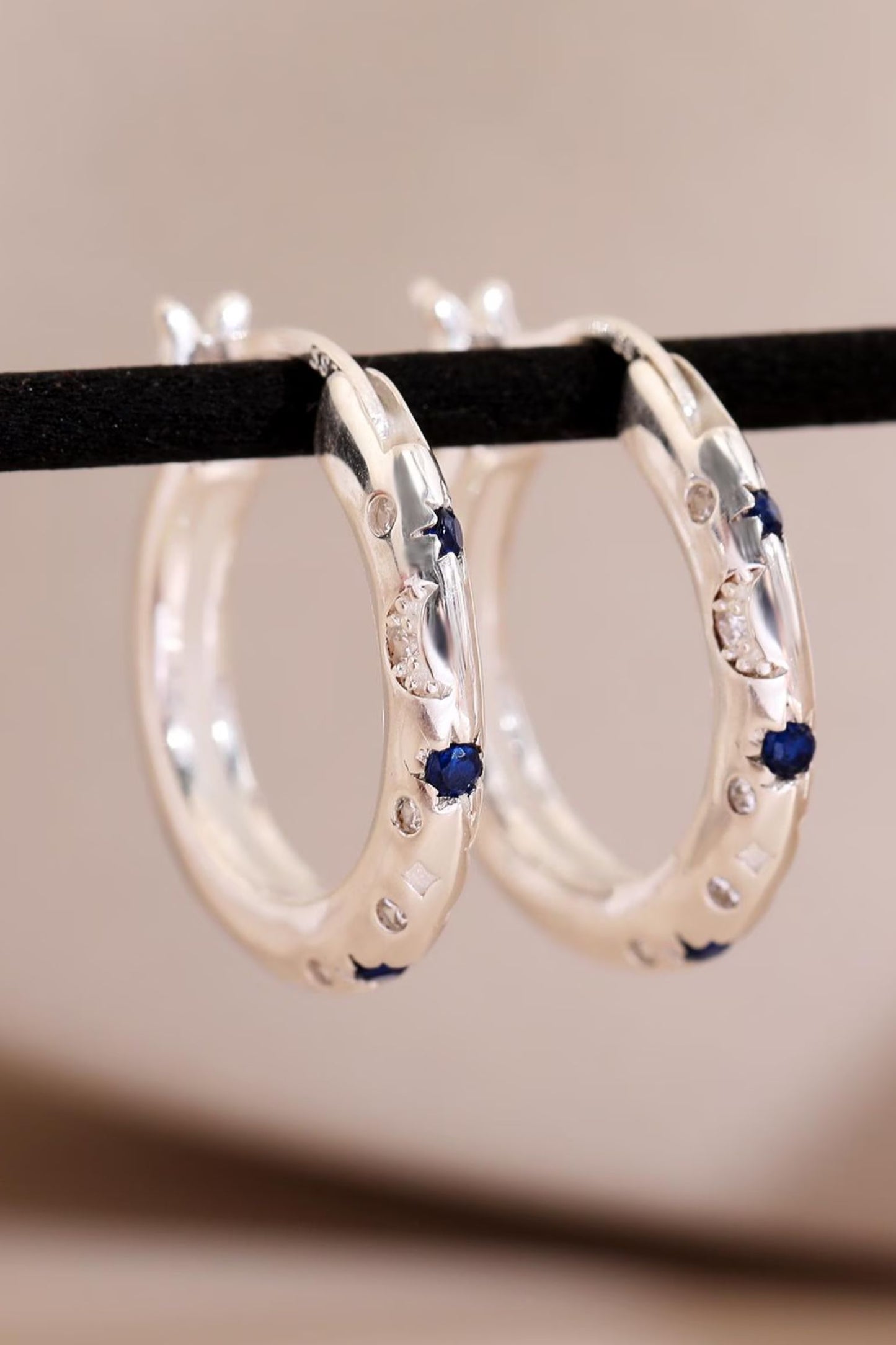 sterling-silver-engraved-celestial-hoops-in-silver-closeup