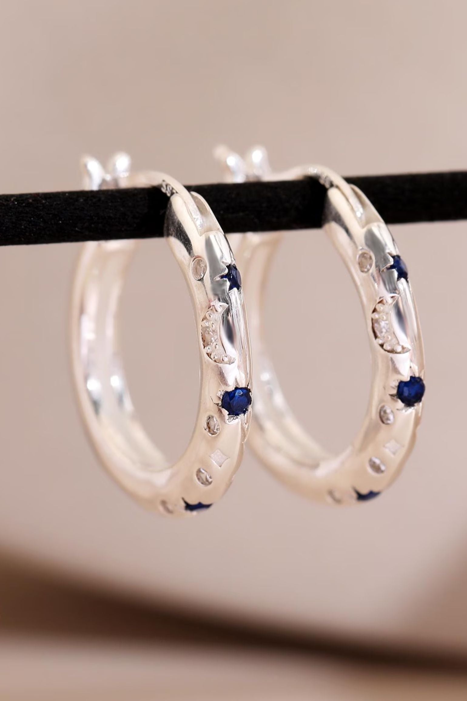 sterling-silver-engraved-celestial-hoops-in-silver-closeup