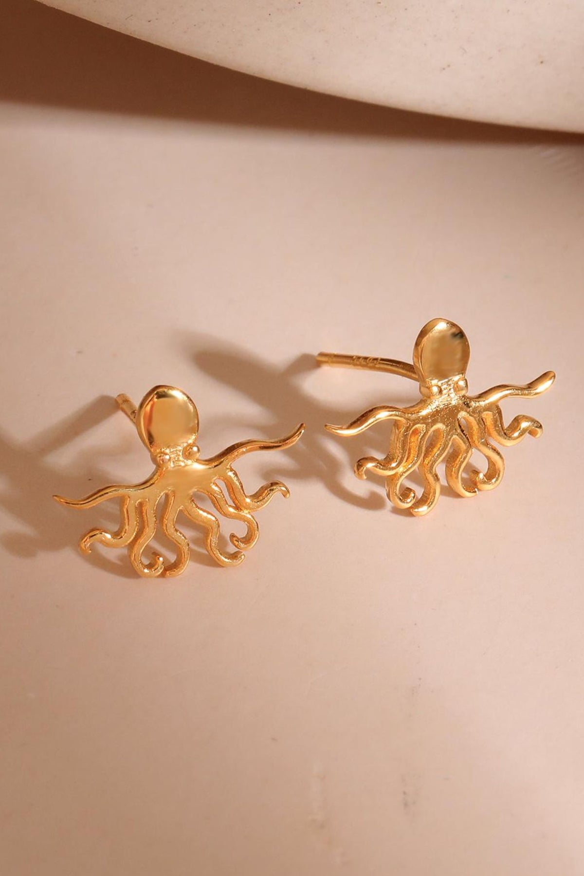 sterling-silver-octopus-studs-in-gold-closeup