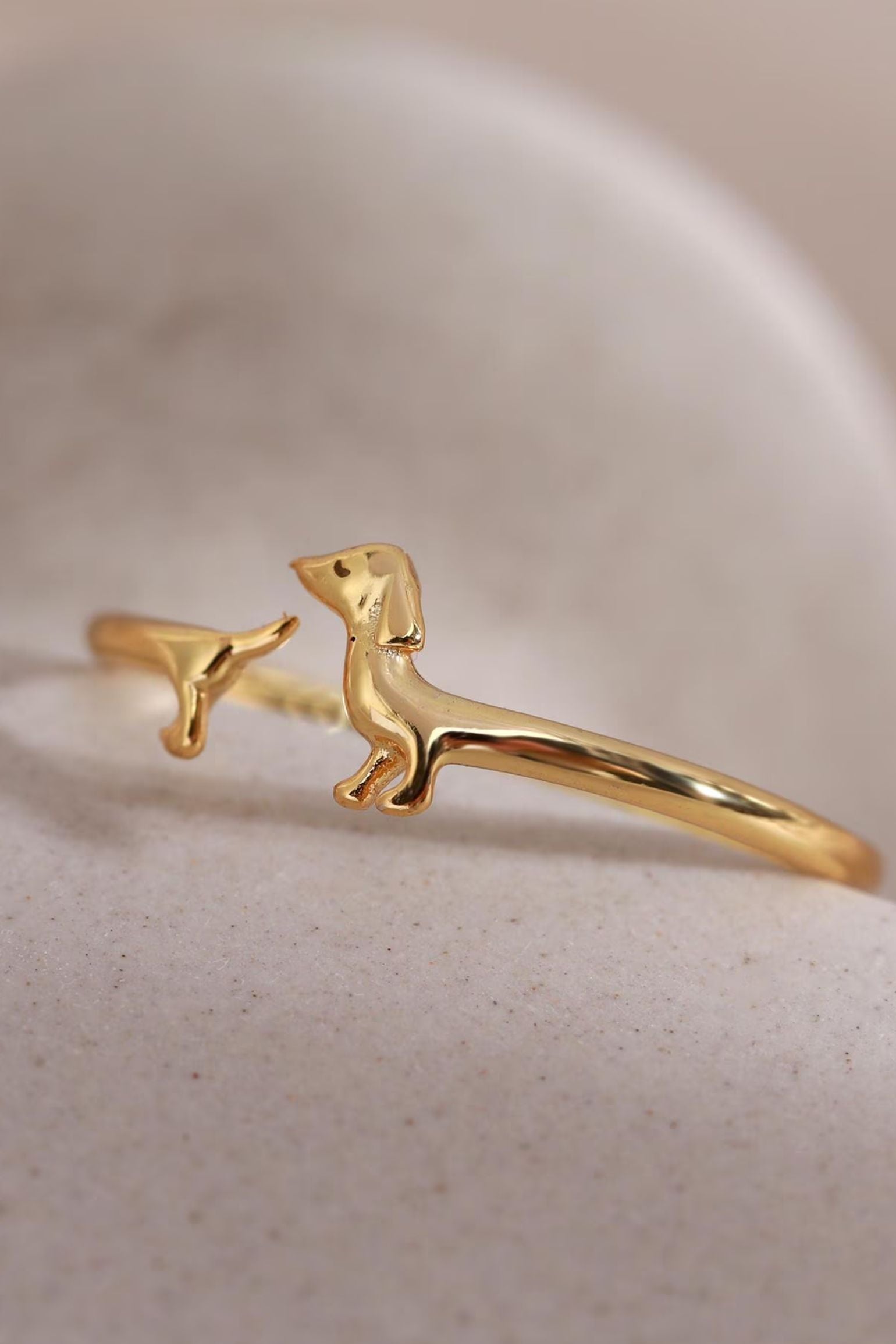 sterling-silver-dainty-sausage-dog-ring-in-gold-closeup