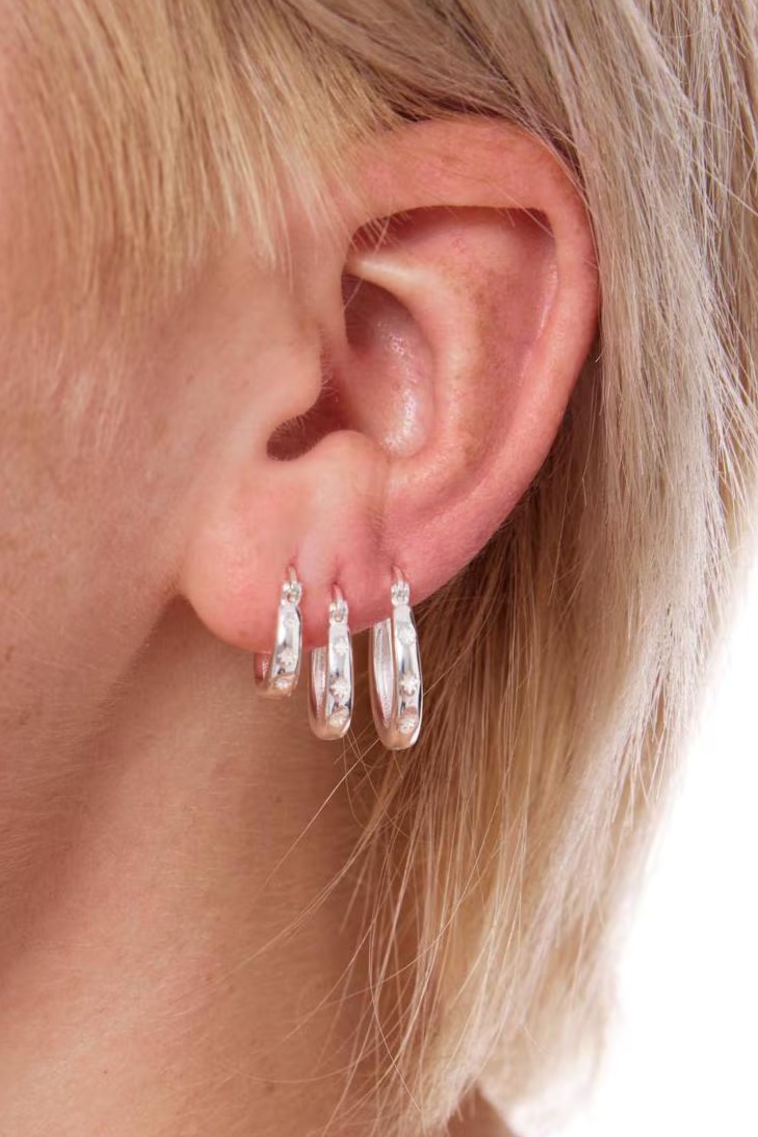 sterling-silver-engraved-starburst-hoops-in-silver-model