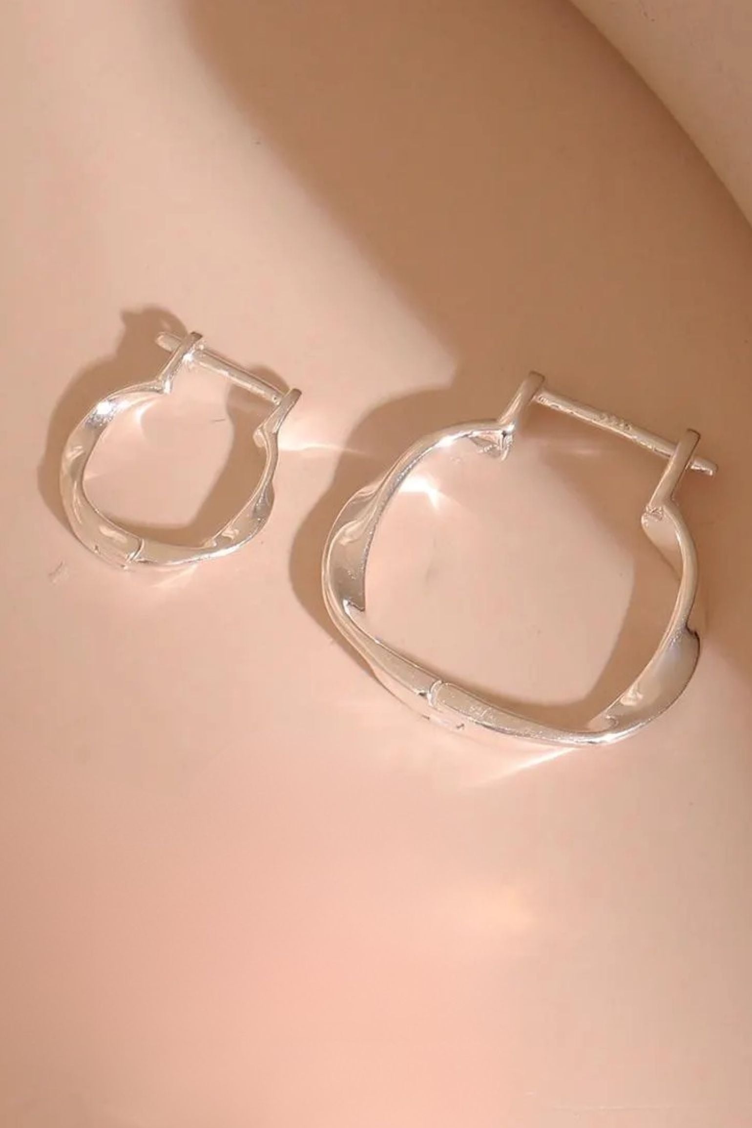 sterling-silver-twist-hoops-in-silver-both-sizes