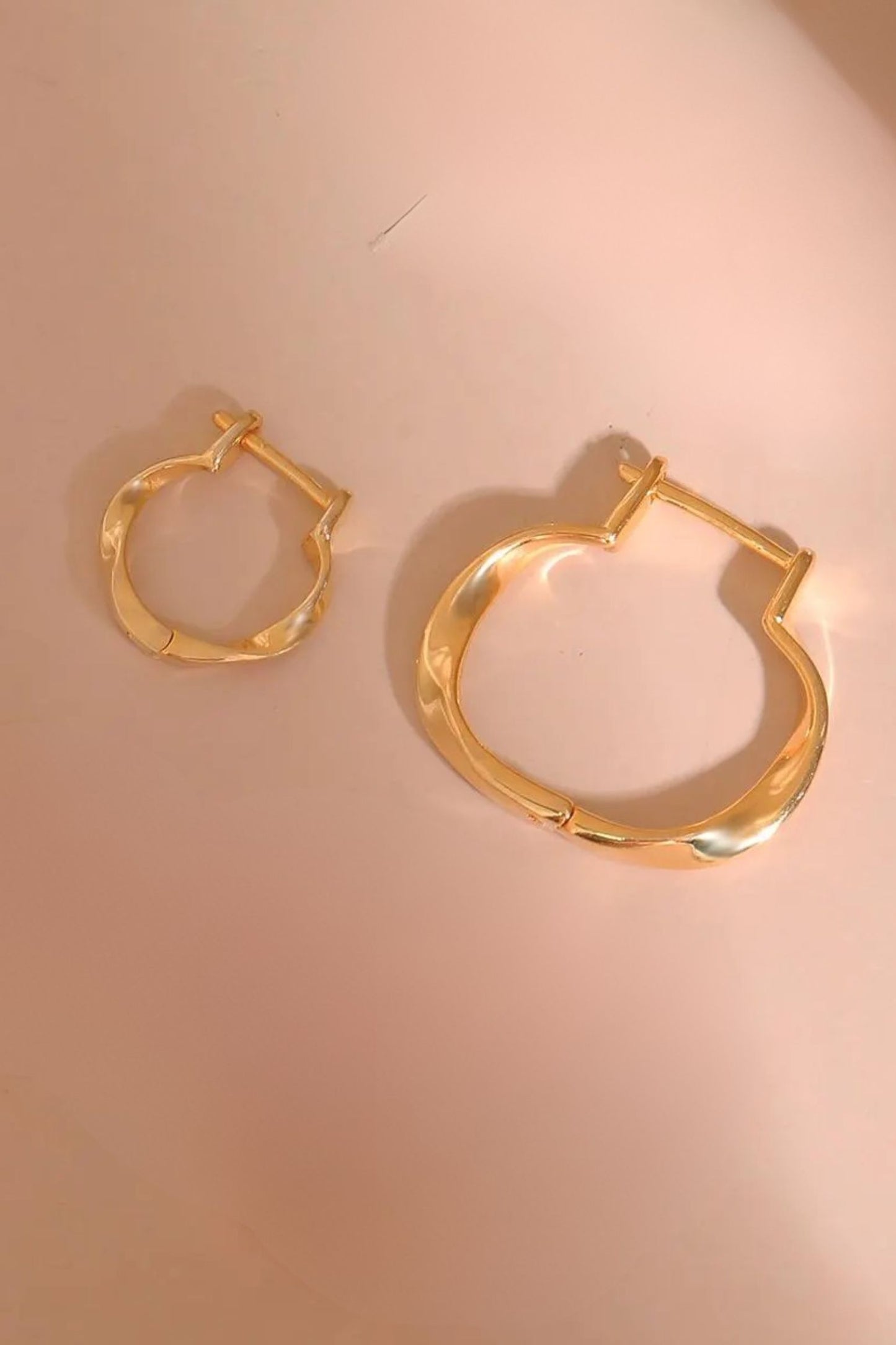 sterling-silver-twist-hoops-in-gold-both-sizes