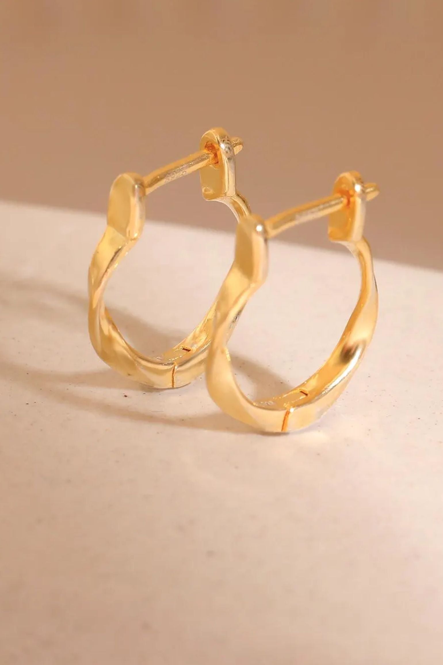 sterling-silver-twist-hoops-in-gold