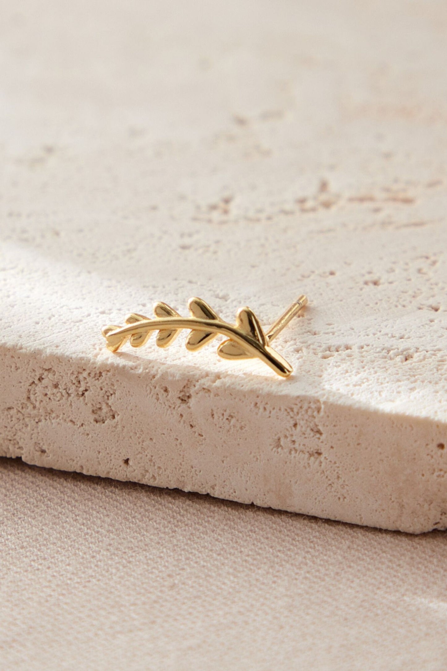 sterling-silver-mismatched-leaf-studs-in-gold-large-stud