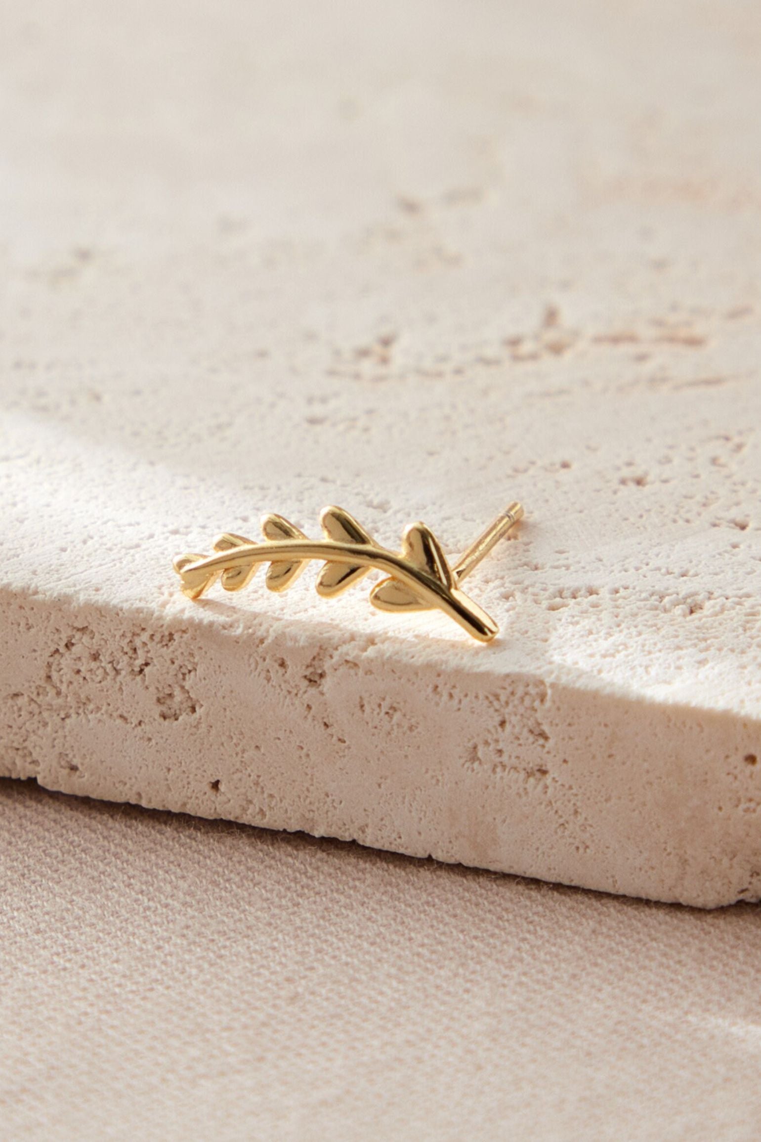 sterling-silver-mismatched-leaf-studs-in-gold-large-stud