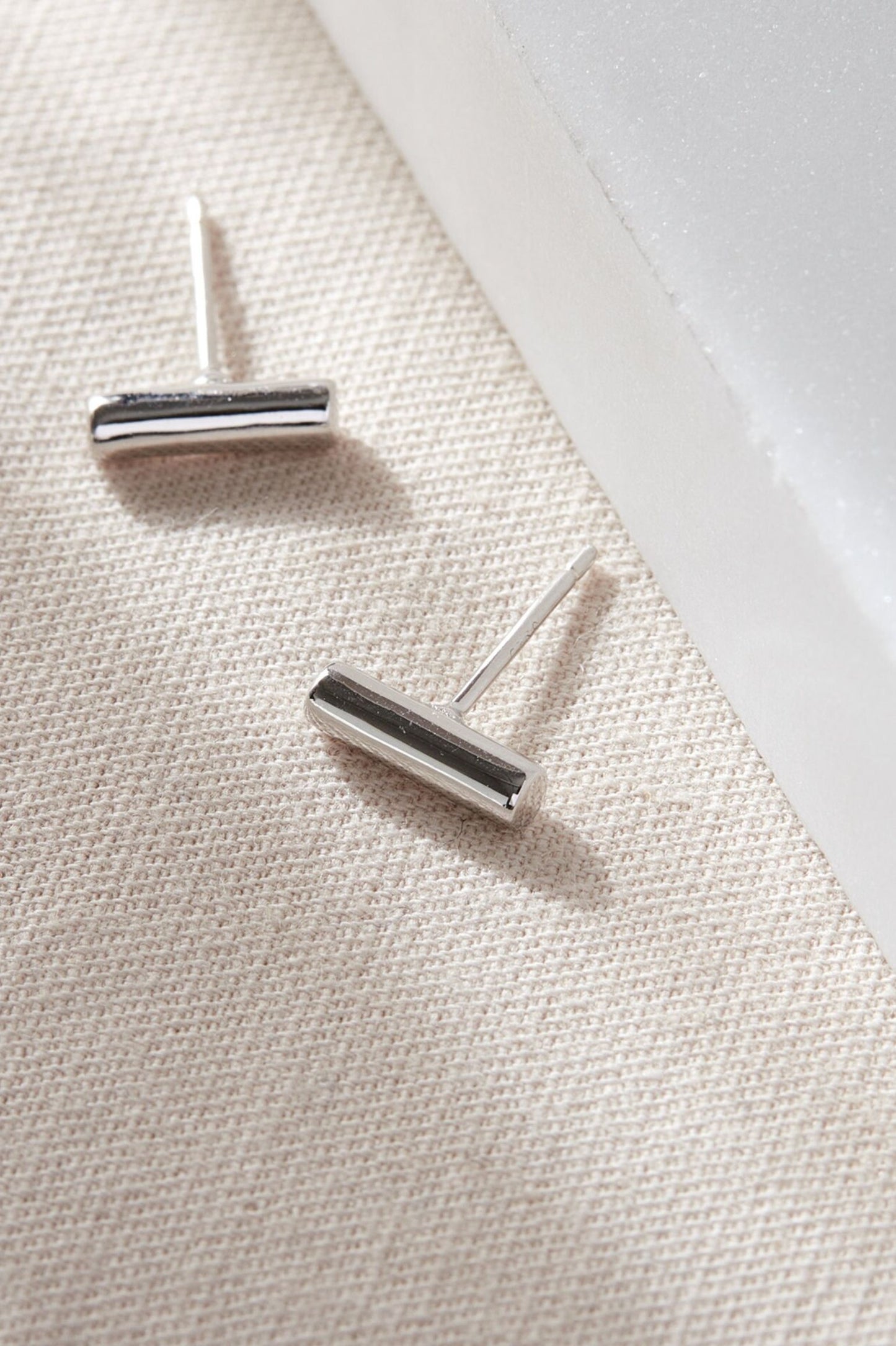 sterling-silver-cylindrical-bar-studs-in-silver-closeup
