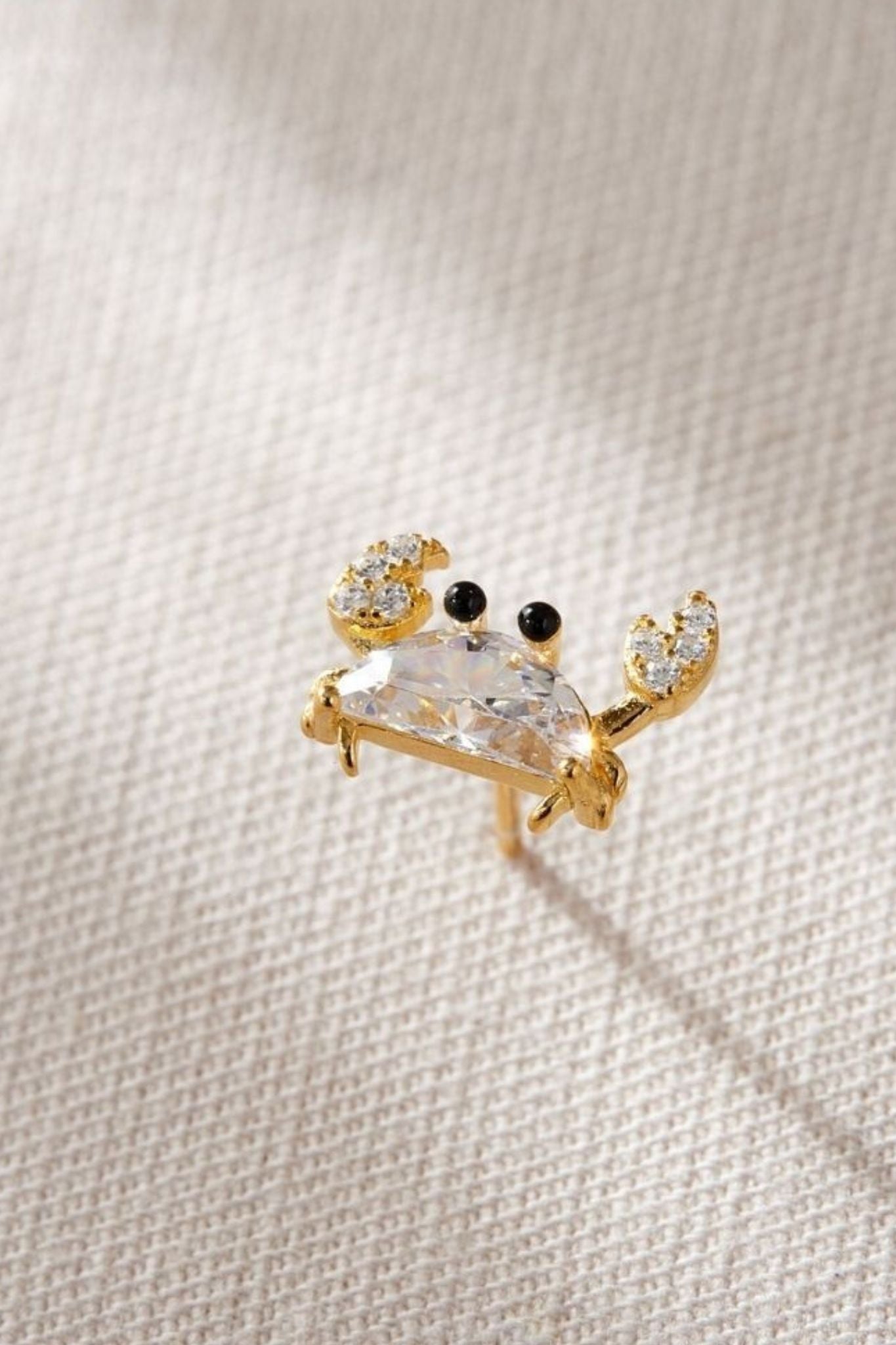 sterling-silver-cz-crab-studs-in-gold-closeup-white-crystal