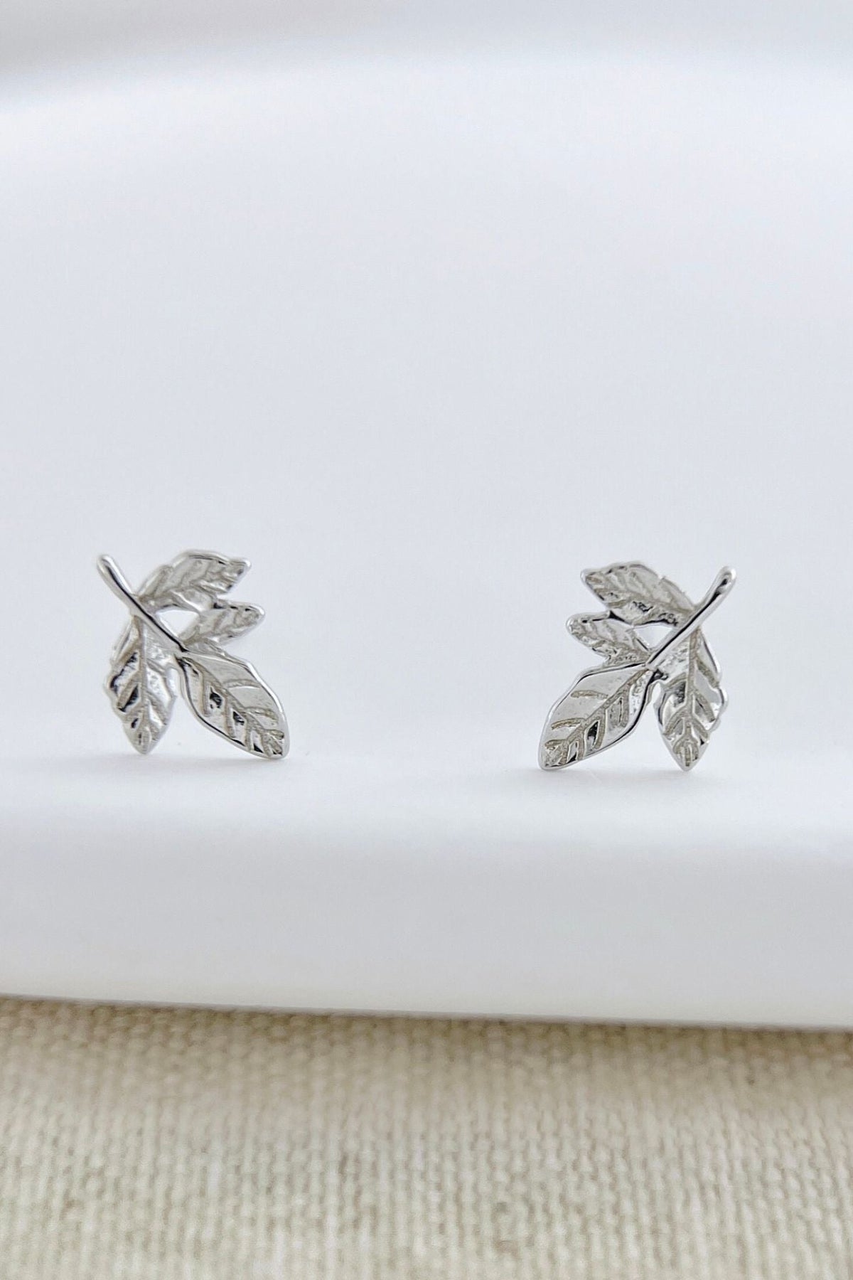 sterling-silver-leaf-stud-earrings-in-silver-closeup