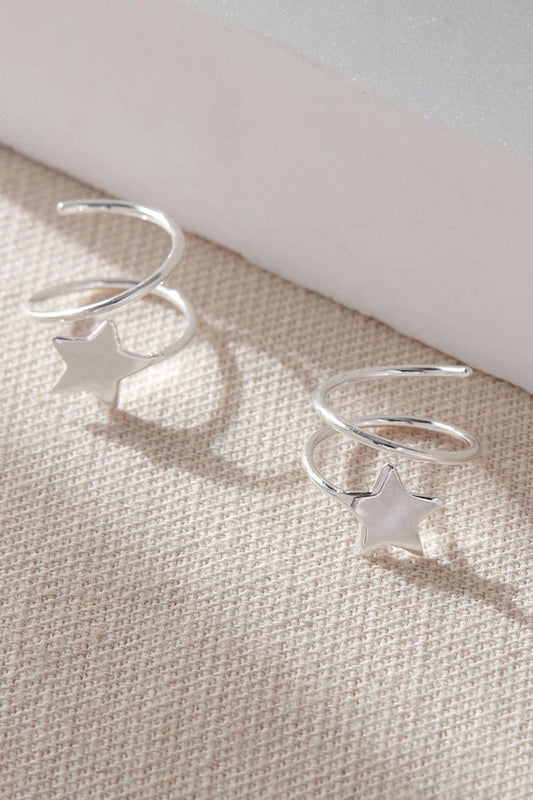 close up of the silver coloured s925 sterling silver star climber earrings