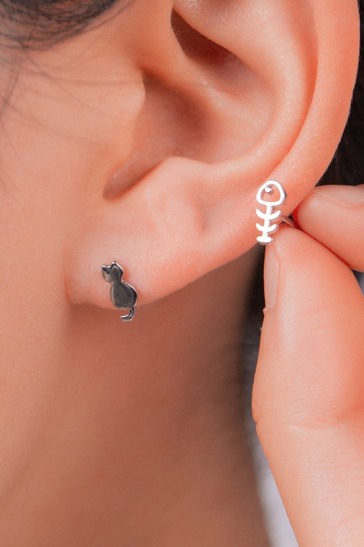 sterling-silver-mismatched-cat-fish-studs-model