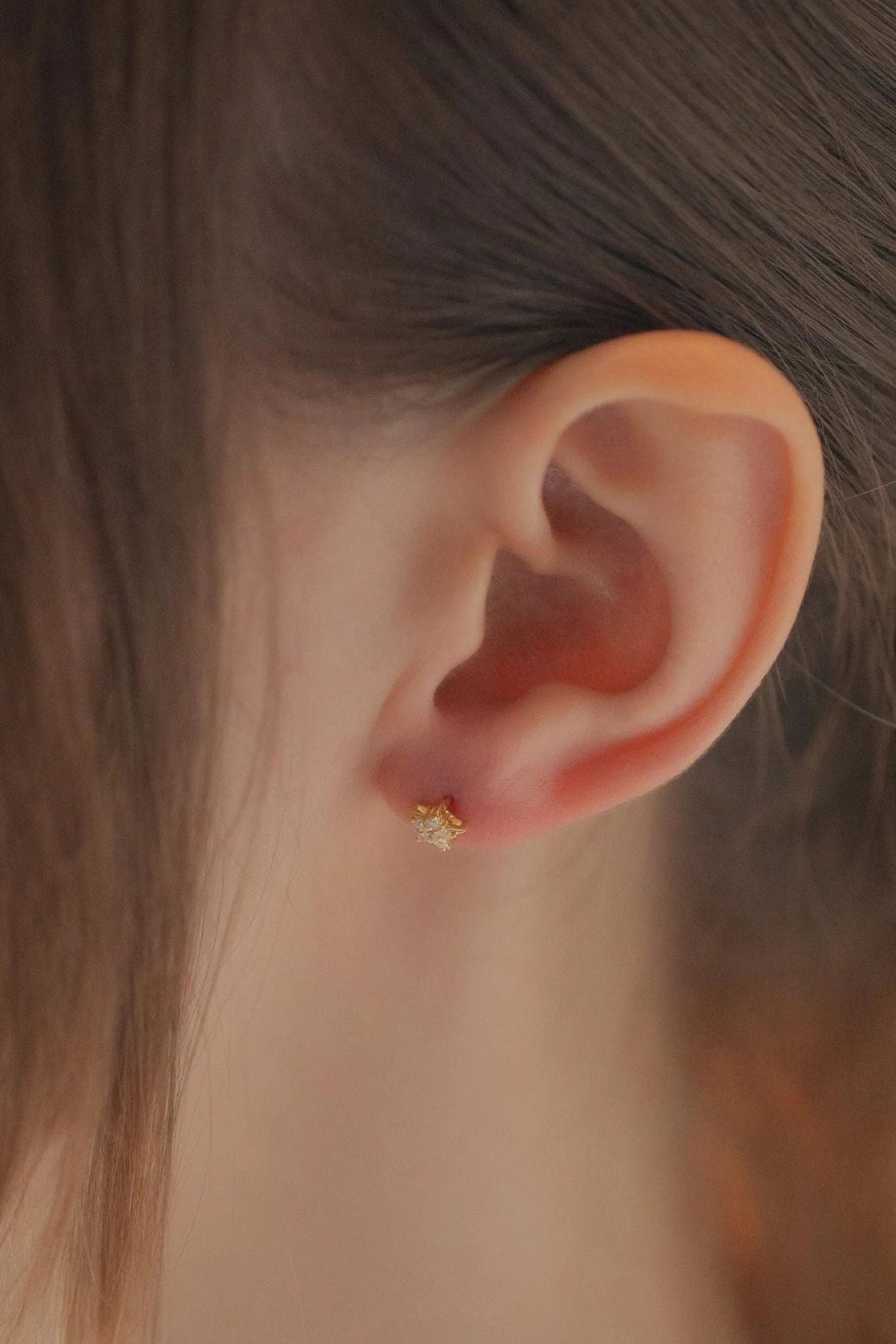 sterling-silver-cz-dainty-star-studs-in-gold-model