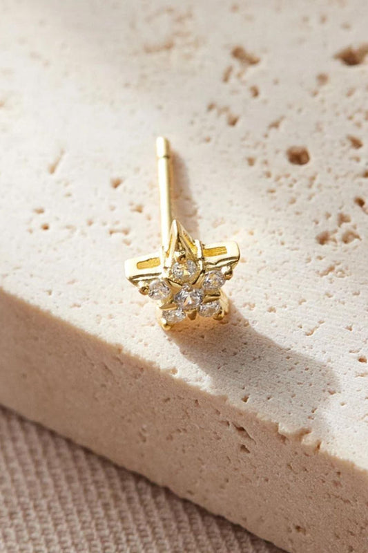 sterling-silver-cz-dainty-star-studs-in-gold-closeup