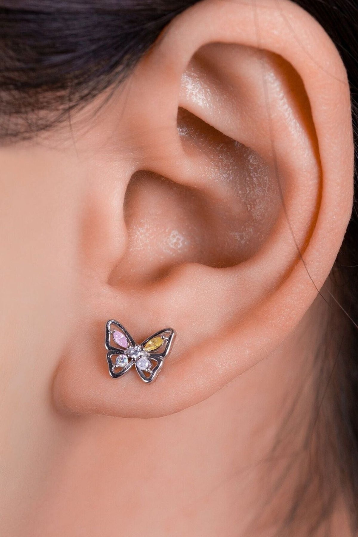 sterling-silver-sparkly-butterfly-stud-earrings-model