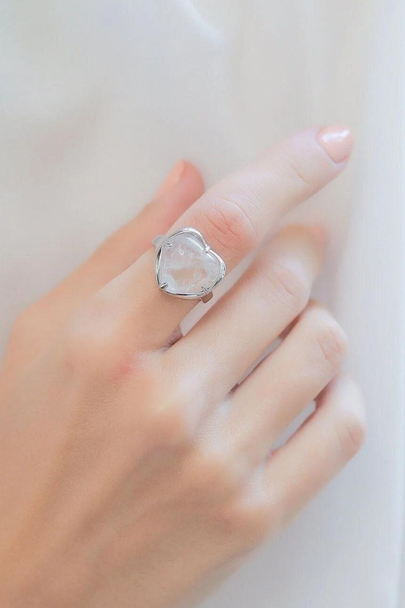 crystal-heart-adjustable-rings-in-white-model-hand