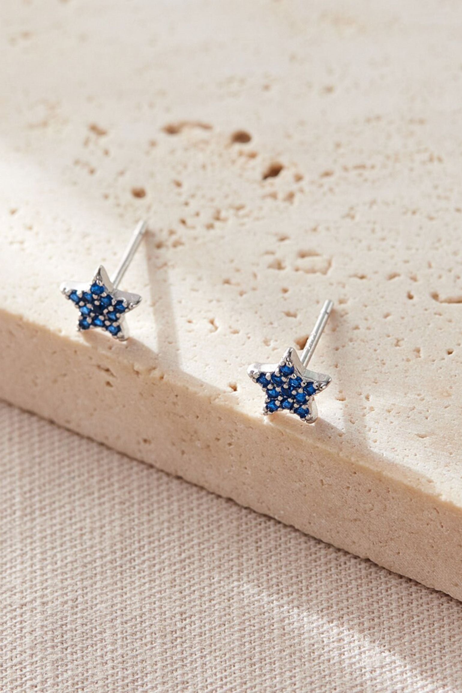sterling-silver-sparkly-star-studs-in-silver-blue