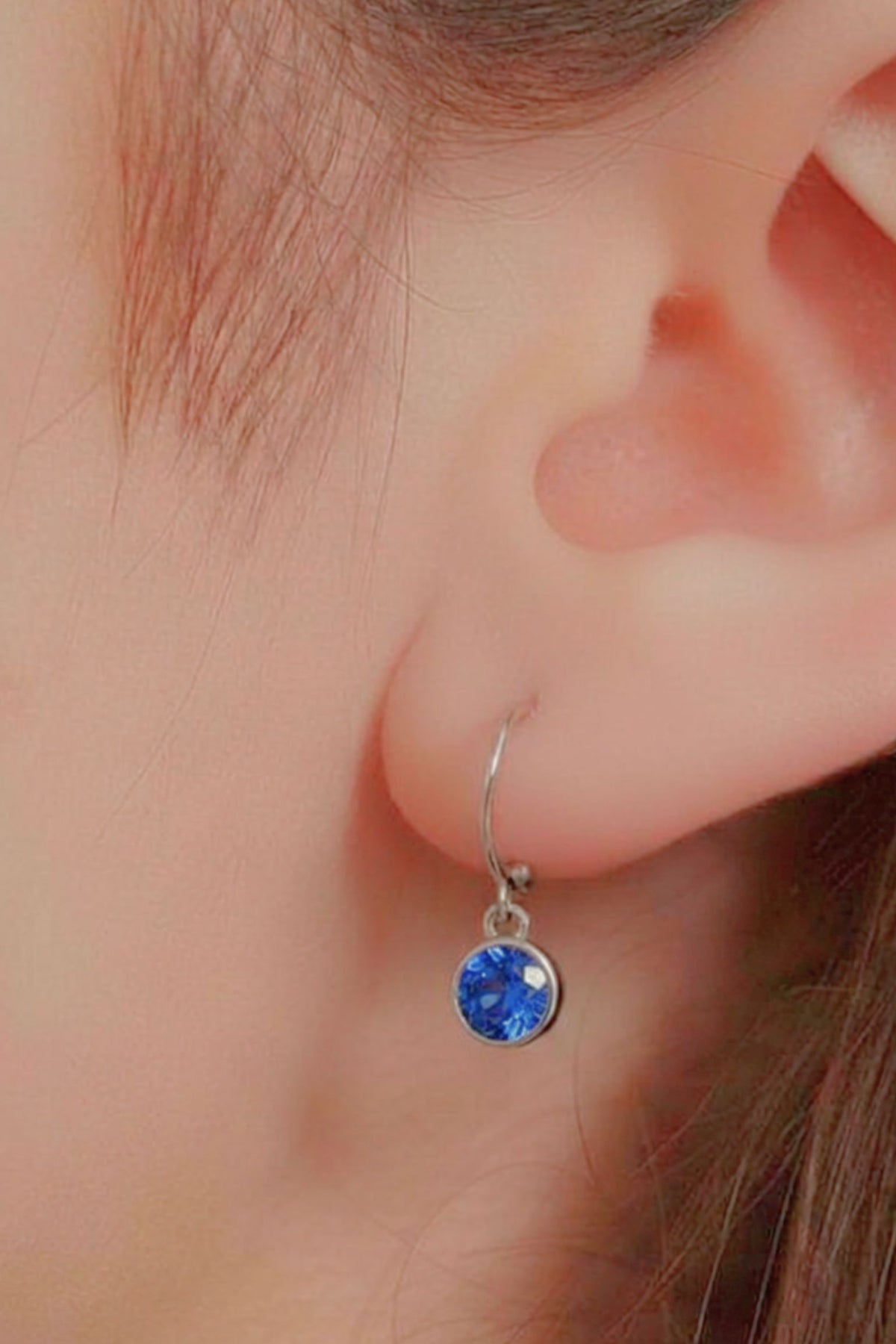 sterling-silver-cz-huggie-hoops-in-silver-light-blue-model