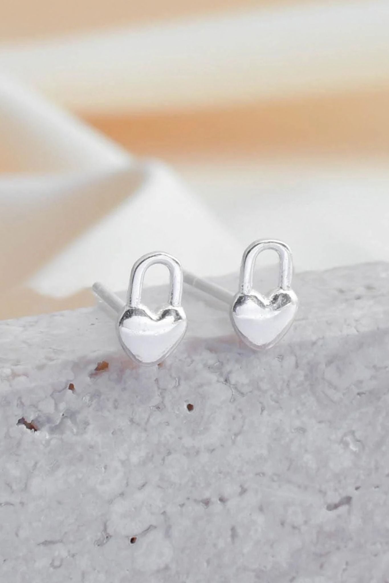 sterling-silver-tiny-heart-lock-studs