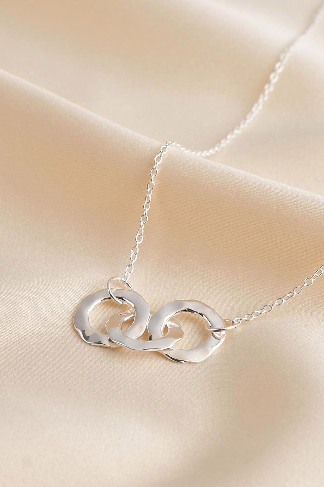 sterling-silver-hammered-triple-ring-necklace-closeup