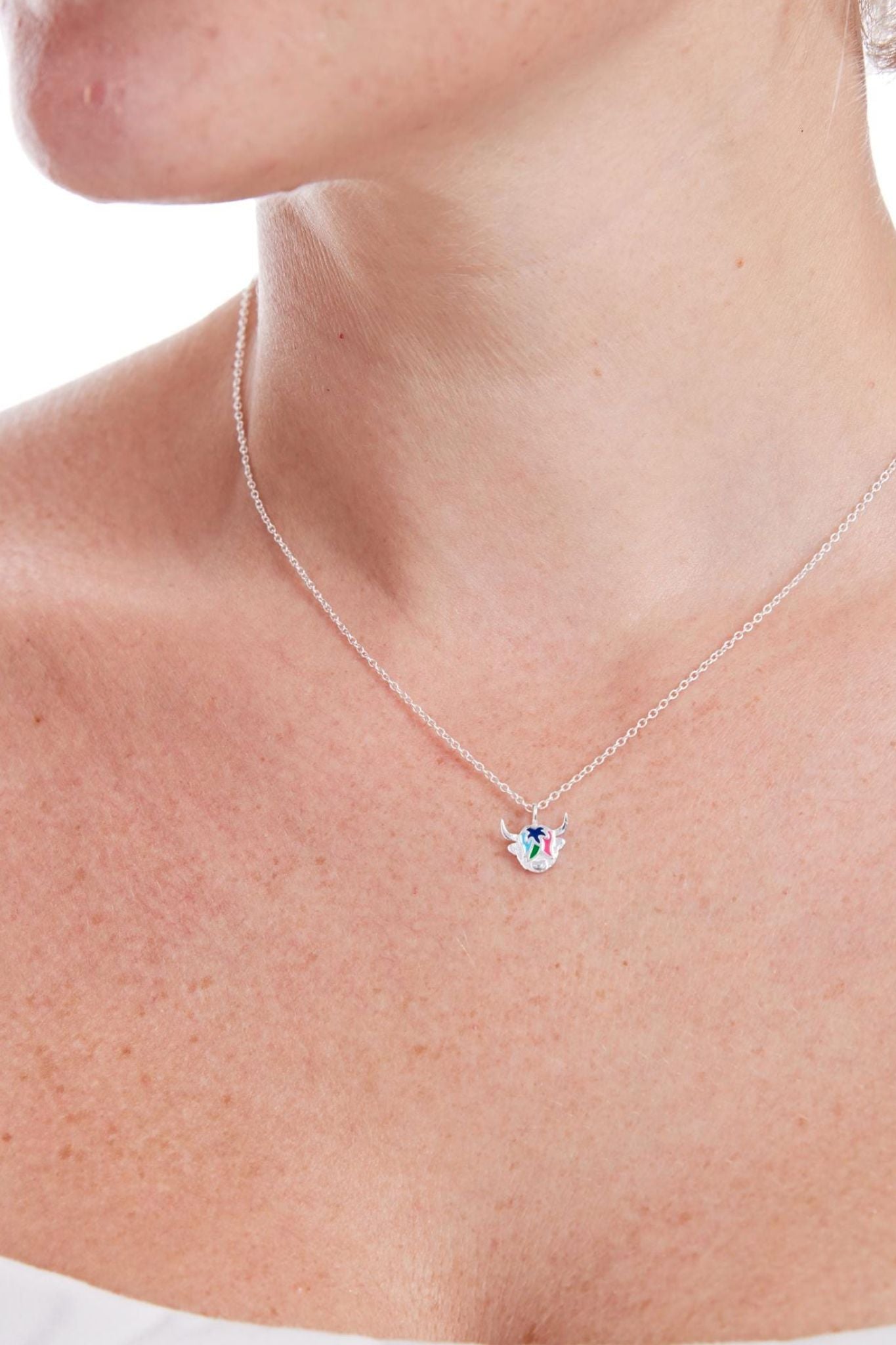 sterling-silver-multicoloured-highland-cow-necklace-model-neckline