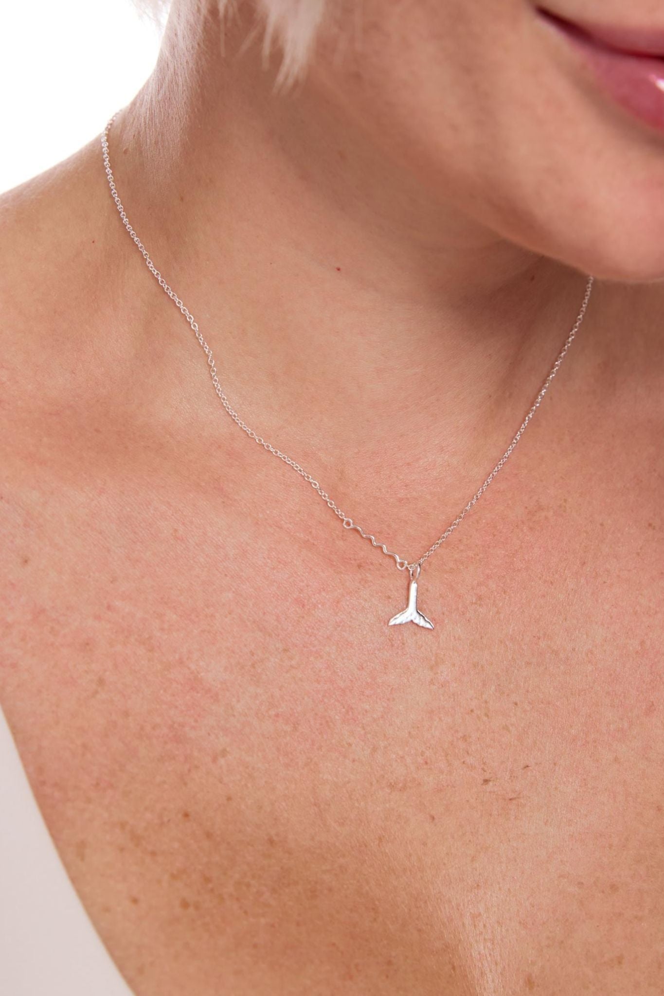 sterling-silver-whale-tail-necklace-model-neckline
