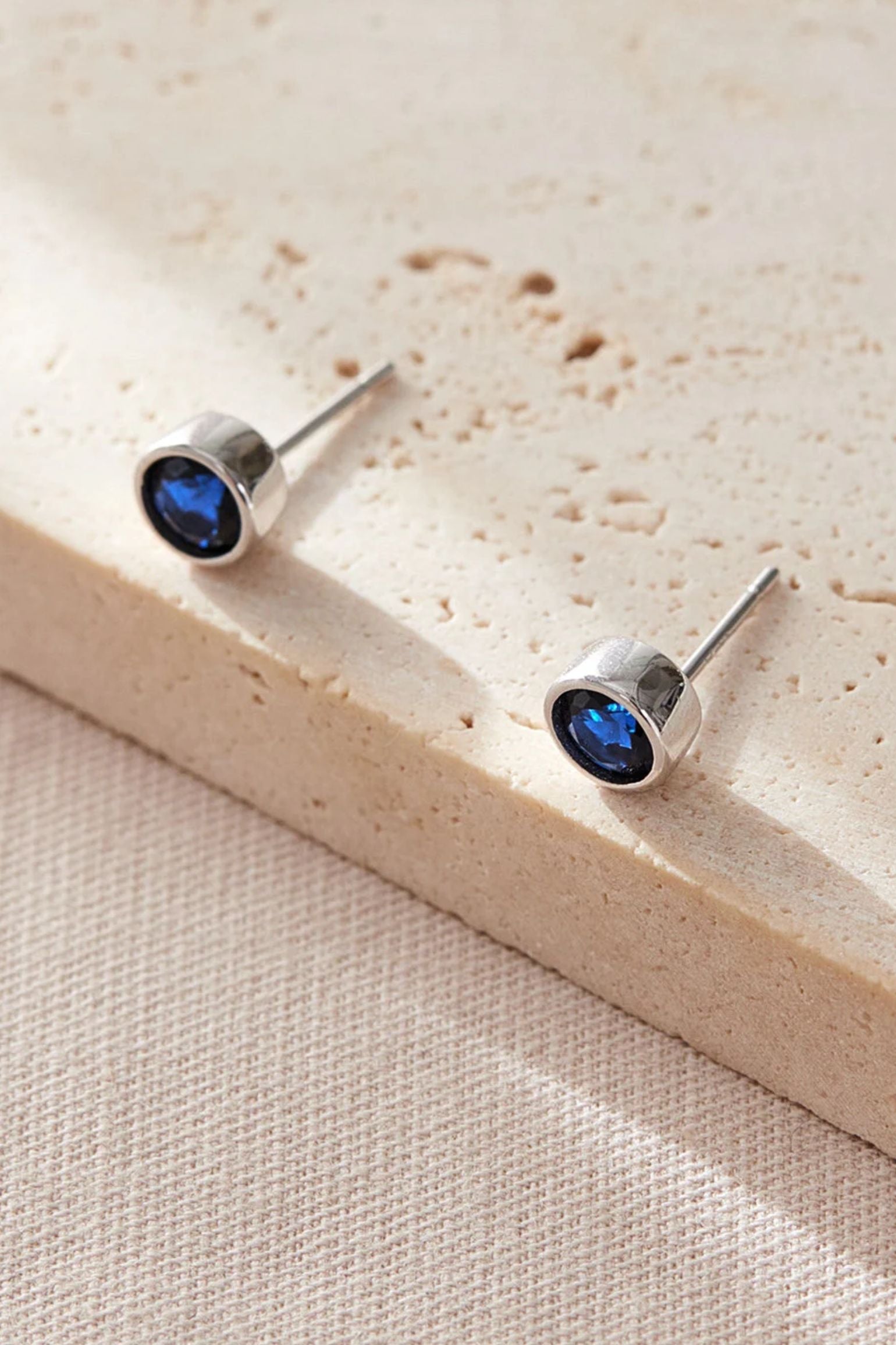 sterling-silver-cz-round-studs-in-silver-midnight-blue