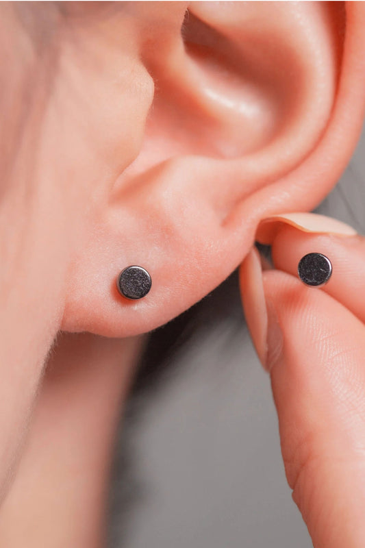 sterling-silver-tiny-disc-studs-in-black-model