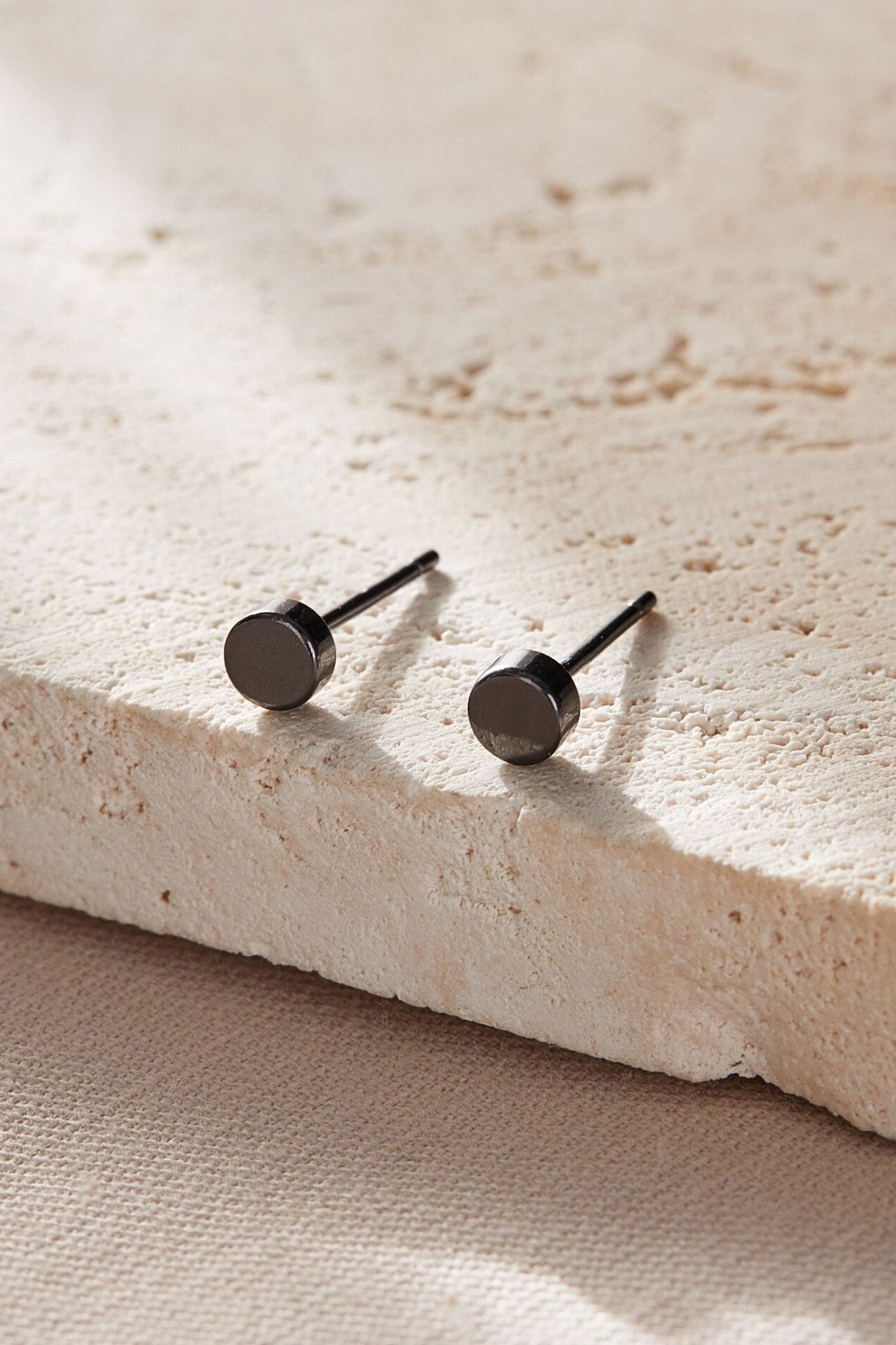 sterling-silver-tiny-disc-studs-in-black
