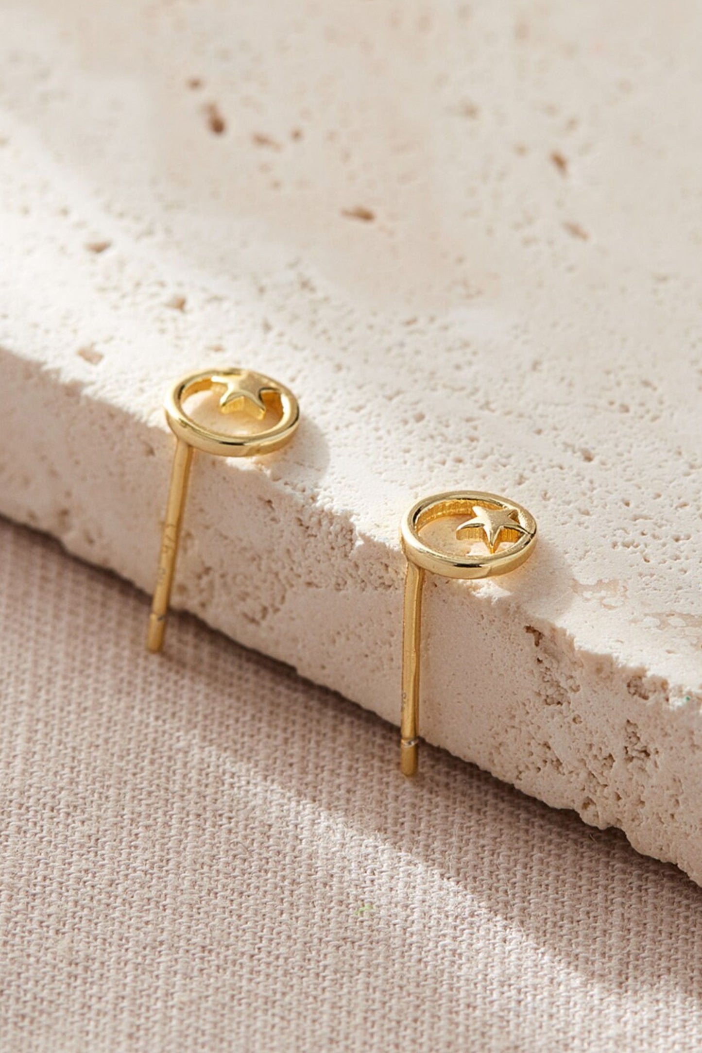 sterling-silver-round-star-studs-in-gold-closeup